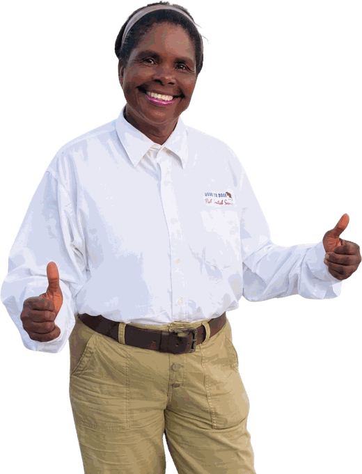 Beverly Phillip, owner of Door to Door Pest Control, smiling with both thumbs up