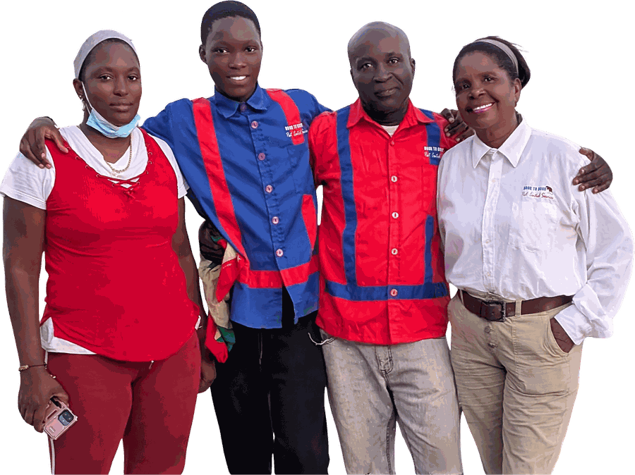 The Door to Door team of four, arm in arm, three of them in the red and blue company shirts and Beverly Phillip in white